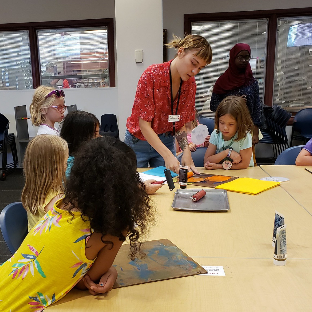 Kids gather around to learn foam block printing