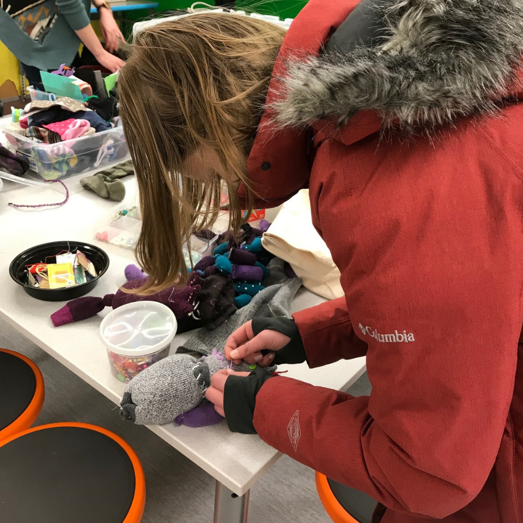 Student makes sock puppet