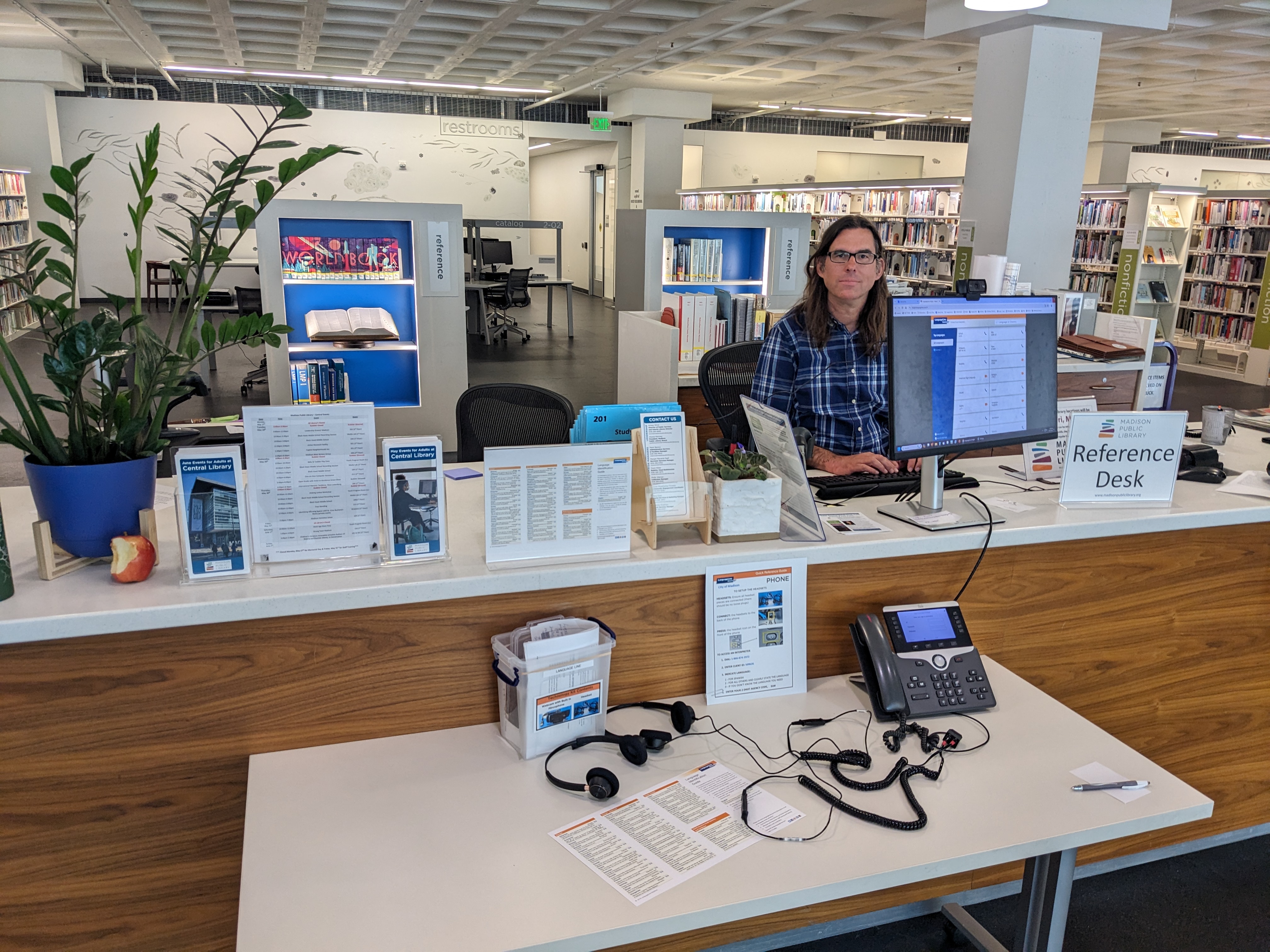 Reception Desk at Central Library featuring live translation devices