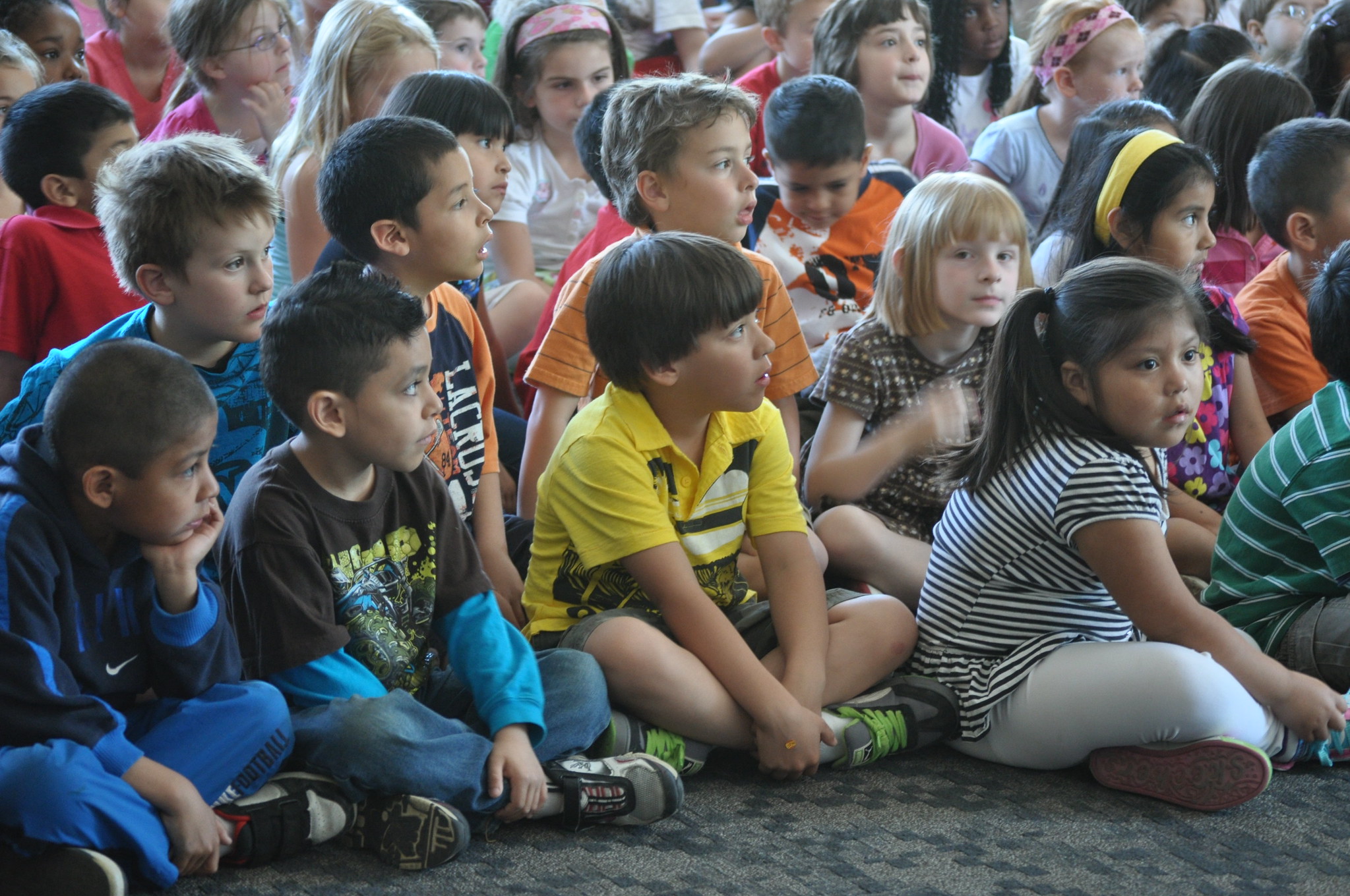 Midvale Elementary School students viewing a special performance from the cast of Disney's The Lion King