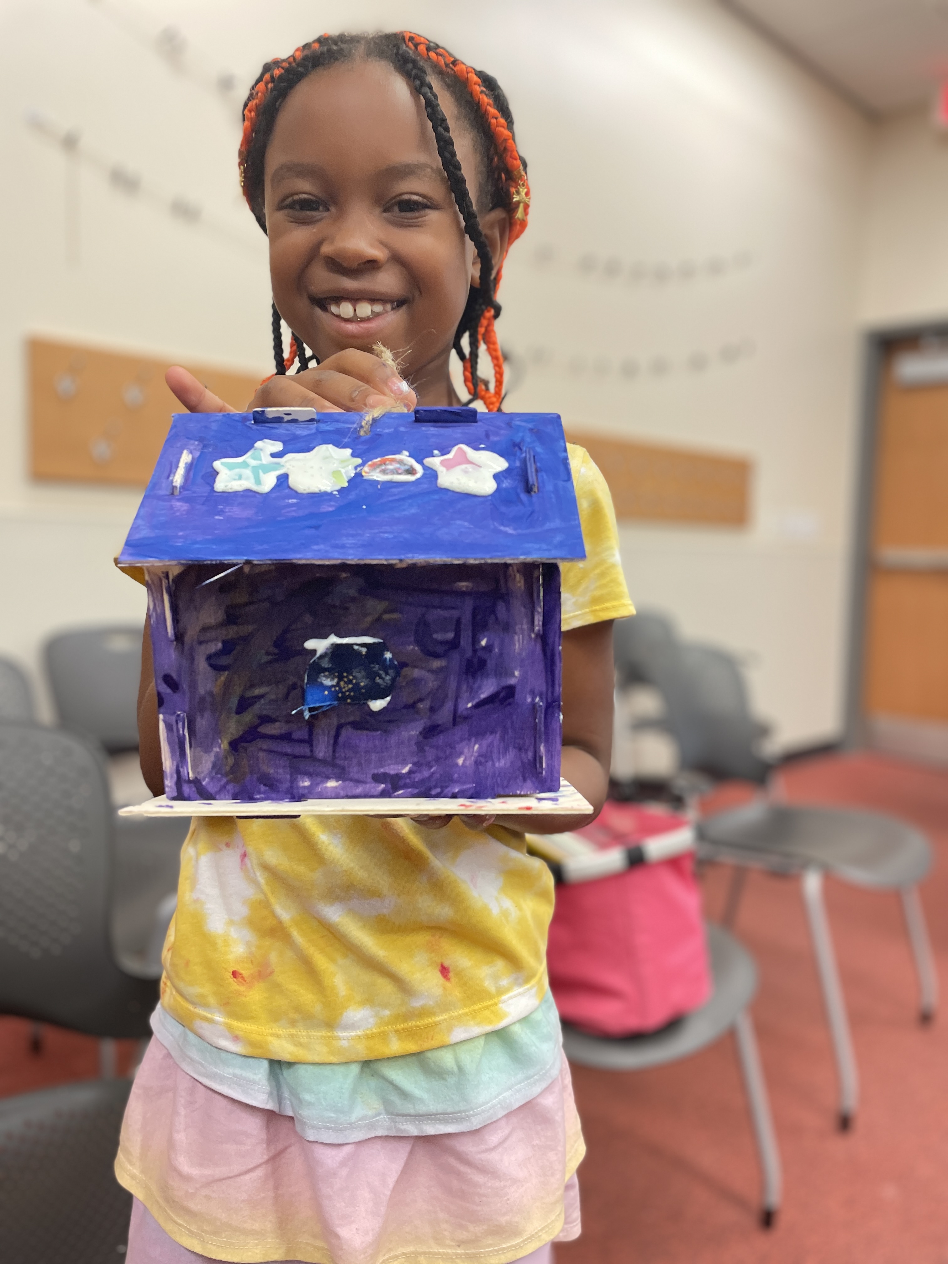 youth with birdhouse 