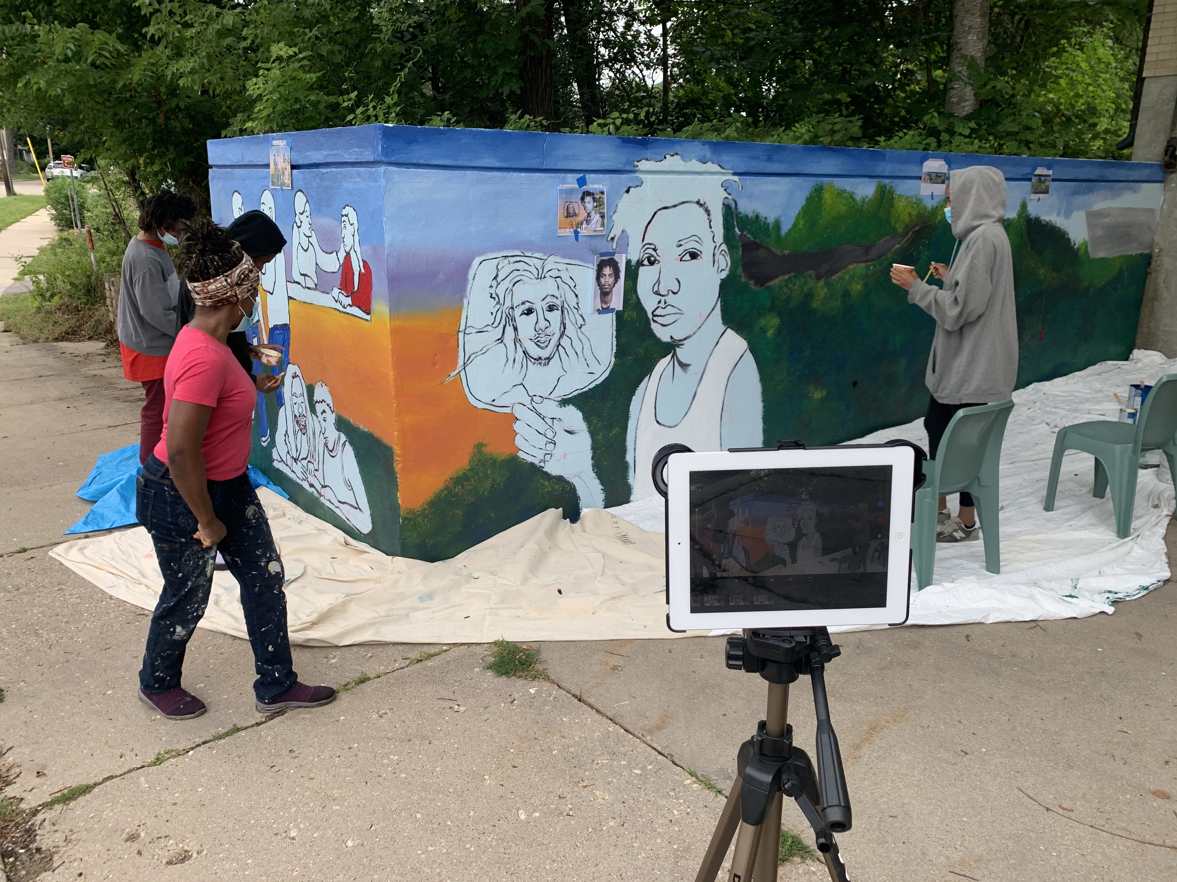 Teens at work on the mural 