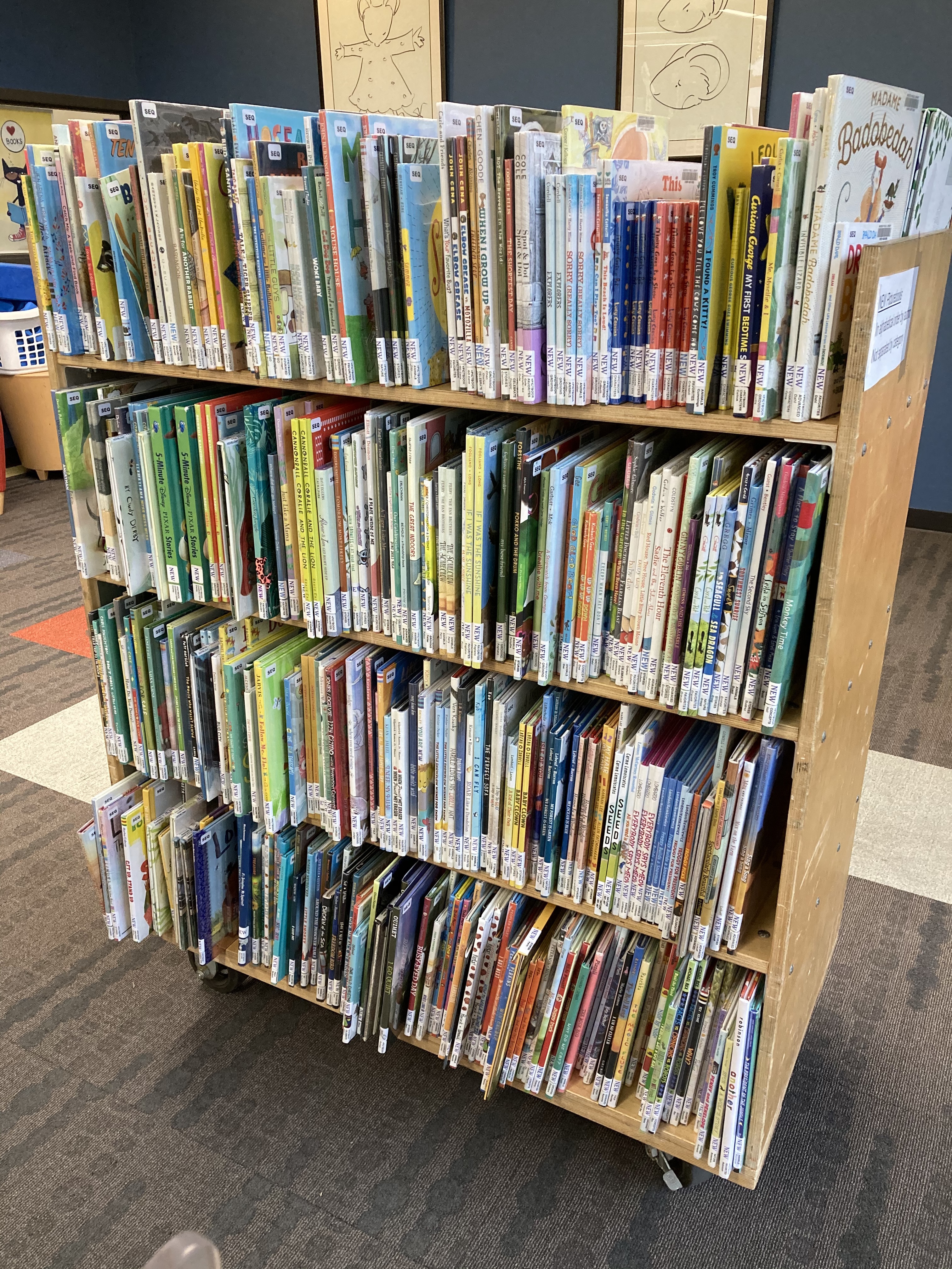 Shelf of new picture books waiting to be checked out 