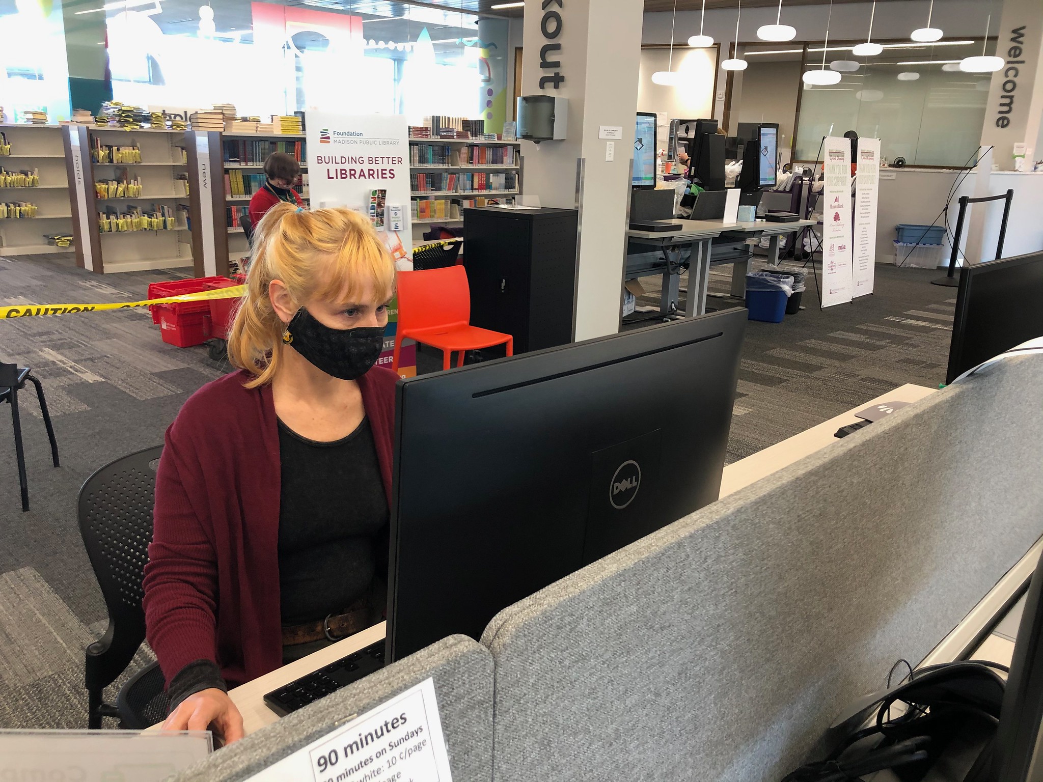 Librarian Crista Parimentner resets a computer for the next patron