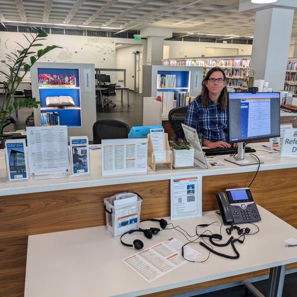 Reception Desk at Central Library featuring live translation devices