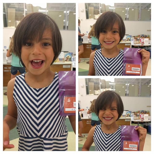 young girl with her first library card