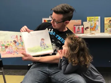 Lee reads I Am Jazz book to his daughter and other folks at Sequoya Library