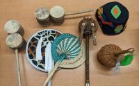 A variety of African instruments laid out on a table
